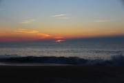 Sunrise - sun peeking over the horizon